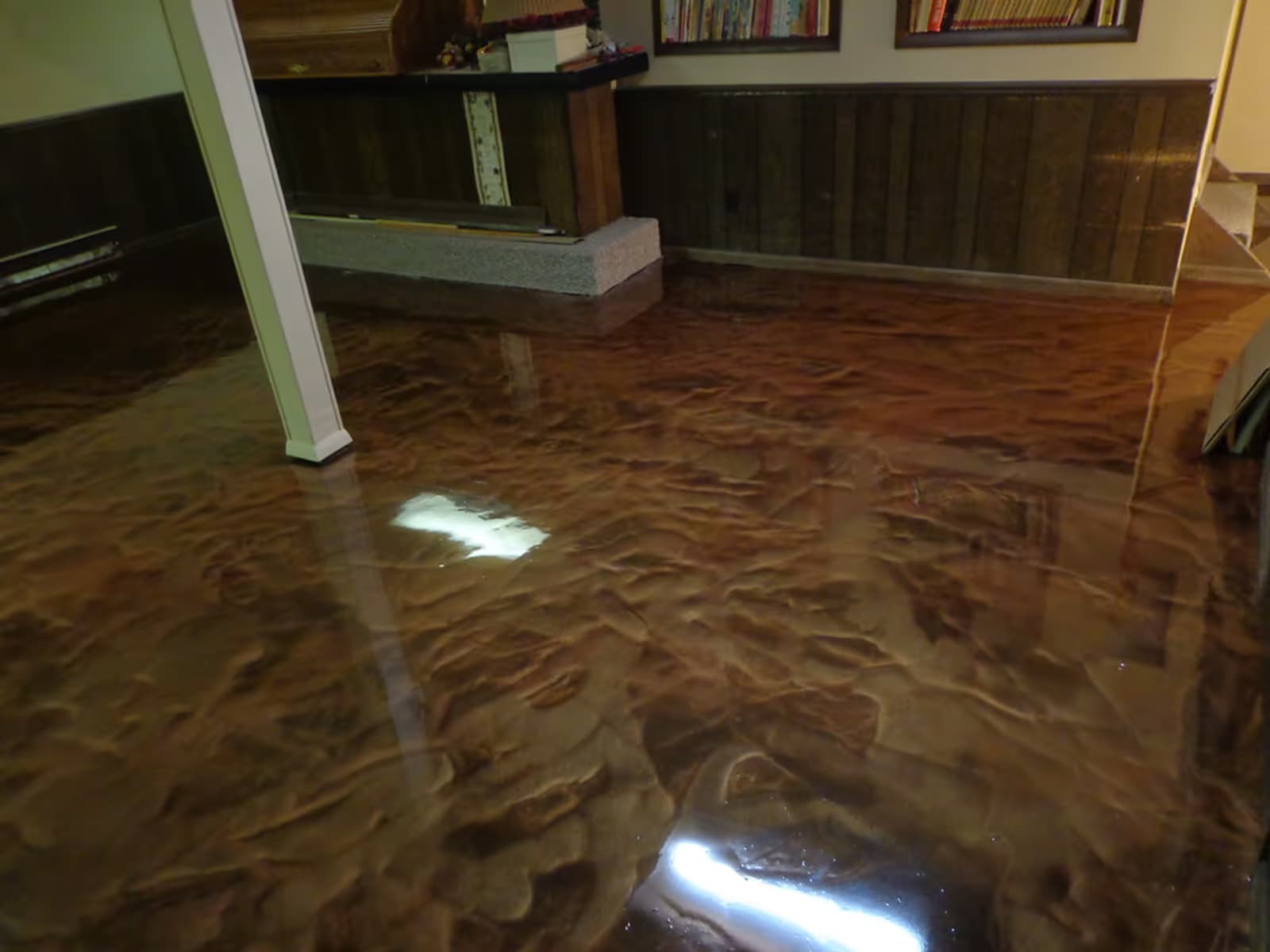 Glossy marbled metallic epoxy floor with rich copper swirl