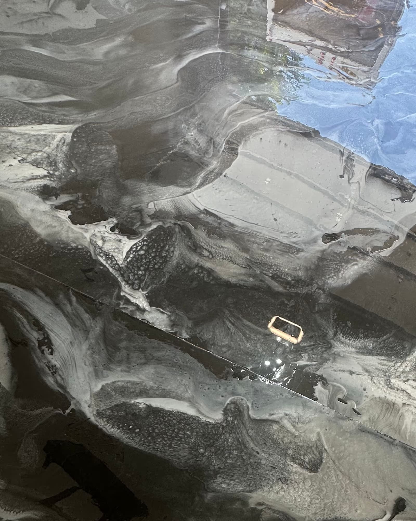 The finished silver metallic epoxy floor Absolute installed in the same garage